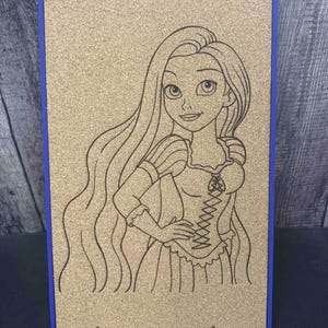 May include: A corkboard with a blue frame features a black line drawing of a princess with long hair. The princess is wearing a dress with a corset design. The corkboard is supported by two metal stands.