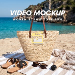 May include: A woven straw tote bag with brown leather handles, resting on a striped beach towel. The bag has a video mockup graphic. Beside the bag are black sandals, sunglasses, and a tube of sunscreen. The text "VIDEO MOCKUP WOVEN STRAW TOTE BAG" is at the top.
