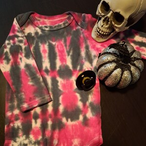 Vibrant fuchsia and black tie dye long sleeve bodysuit