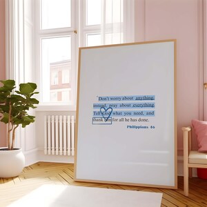 May include: Whiteboard with a quote from Philippians 4:6, "Don't worry about anything: instead, pray about everything. Tell God what you need, and thank him for all he has done."