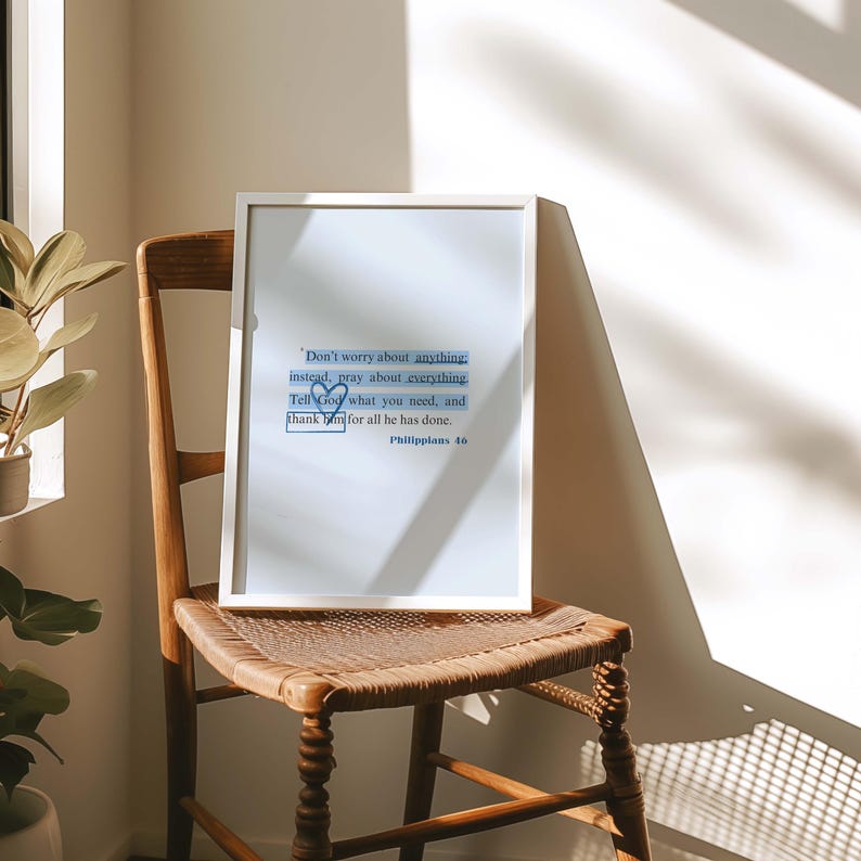 May include: White framed print with a blue and white heart design. The print features the text "Don't worry about anything: instead, pray about everything. Tell God what you need, and thank him for all he has done. Philippians 4.0"
