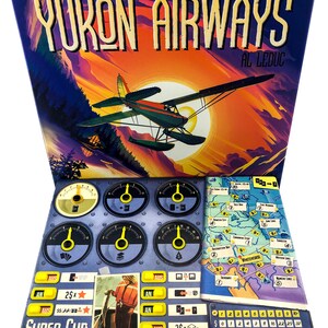 May include: Yukon Airways board game box and game components. The box features a vintage illustration of a seaplane against a sunset. Game components include a game board, dials, and cards. The text "YUKON AIRWAYS" and "SUPER CUB" are visible.