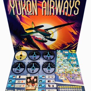 May include: A board game box titled "Yukon Airways" with a colorful illustration of a seaplane flying in front of a sunset. The game includes a control panel, map, and game pieces. The text "Turbo Beaver" is visible.