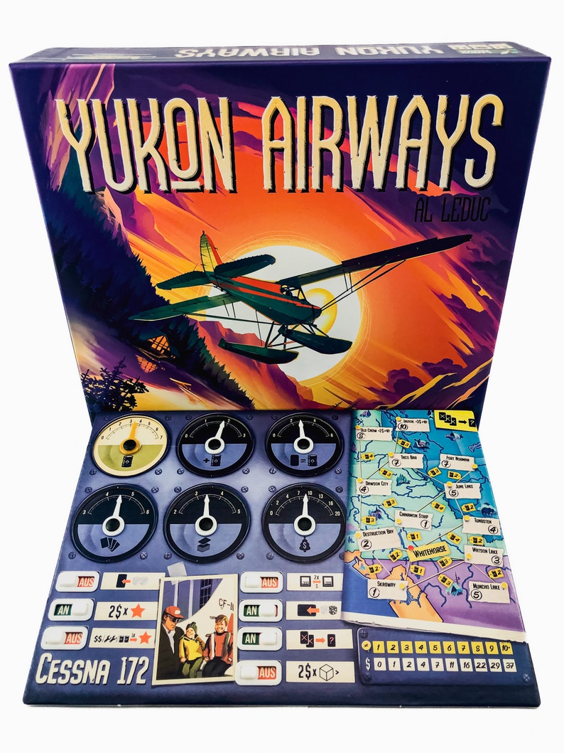 May include: Yukon Airways board game box with a vintage airplane illustration against a sunset backdrop. The game includes various game pieces, dials, and a map. The box features the text "Yukon Airways" and "Al Leduc". The Cessna 172 is also visible.
