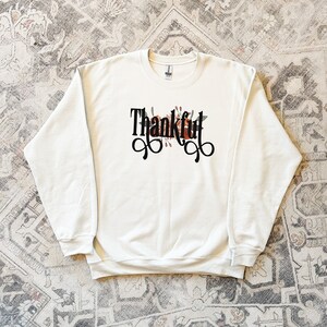 Women&#39;s Handmade Designs tops | made in the USA | Thankful Floral Sweatshirt
