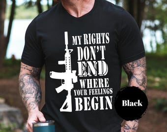 May include: Black V-neck t-shirt with a white graphic of a rifle and the text "MY RIGHTS DON'T END WHERE YOUR FEELINGS BEGIN". The word "Black" is in a black circle on the bottom right.