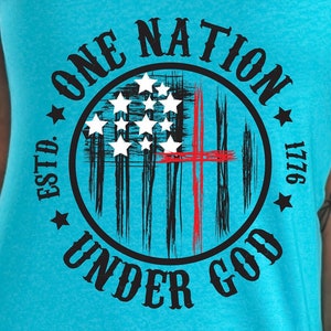 May include: A turquoise blue tank top with a black and white graphic of an American flag with a red cross superimposed over it. The graphic is in a circle with the text "ONE NATION UNDER GOD ESTD. 1776" around it.