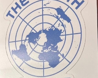 May include: A white sticker with blue text and a blue outline. The sticker says "THE EARTH IS FLAT" and features a flat earth map with a grid pattern.