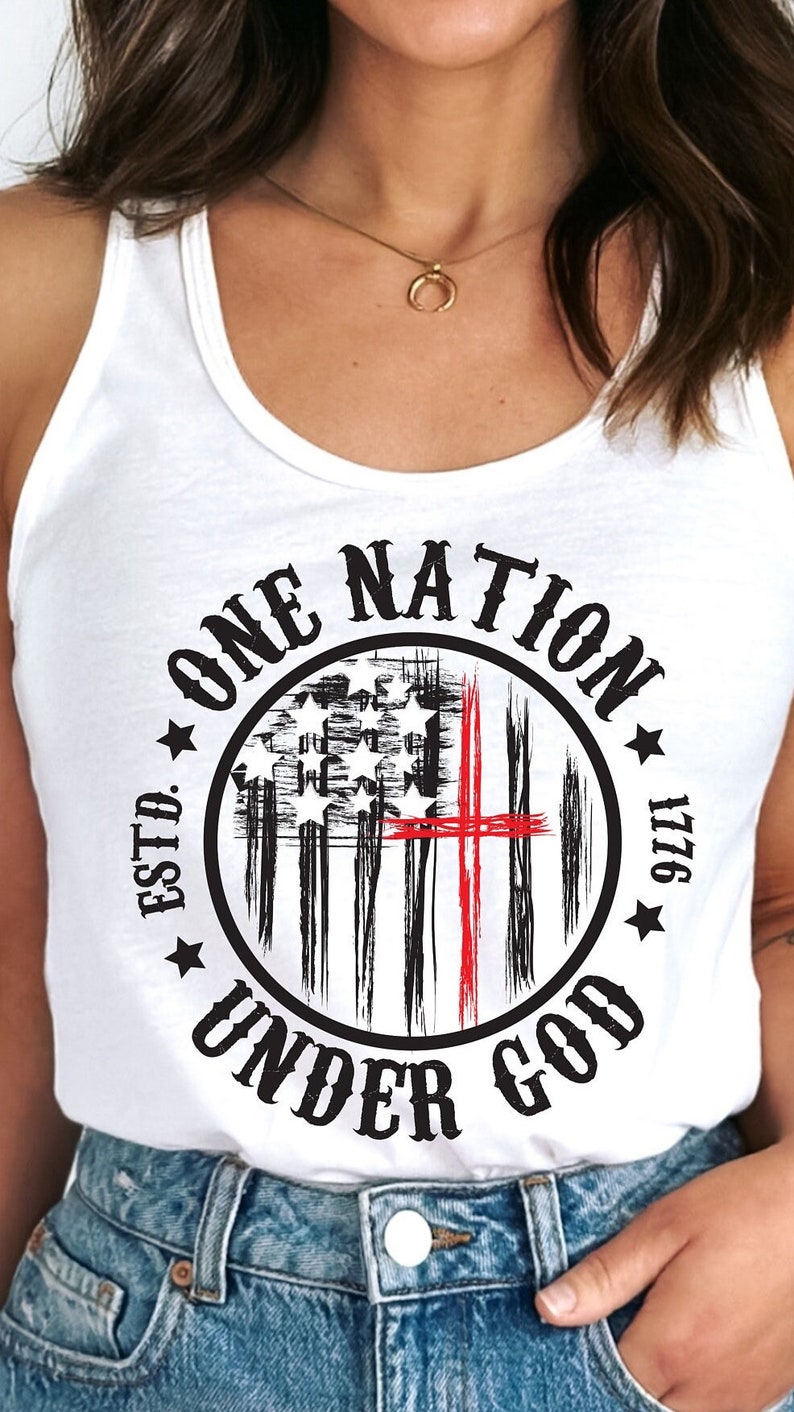 May include: White tank top with a black and red graphic print of a stylized American flag with the text "ONE NATION ESTD. 1776 UNDER GOD".