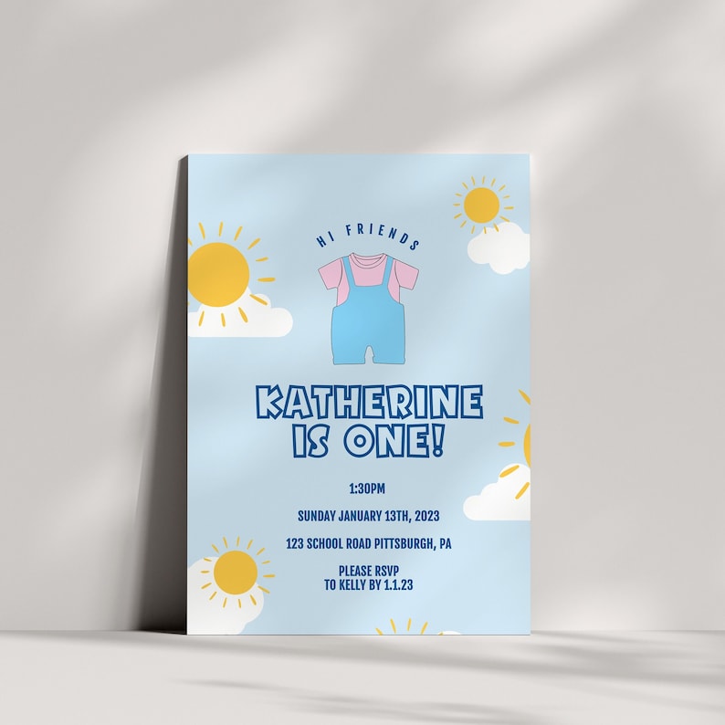 May include: A blue and pink baby onesie with a sun and cloud design. The text "Hi Friends" is at the top of the invitation. The text "Katherine is One!" is in a bold blue font. The text "1:30PM Sunday January 13th, 2023 123 School Road Pittsburgh, PA Please RSVP to Kelly by 1.1.23" is in a smaller blue font.