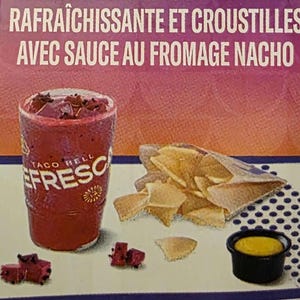 May include: An image of a Taco Bell meal featuring a red beverage in a cup with the word "Fresco" on it, tortilla chips, and a small bowl of nacho cheese sauce. The text at the top reads "Agua Fresca & Chips and Nacho Cheese Sauce".