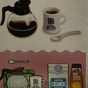 May include: A collection of miniature coffee-themed items, including a glass coffee pot, a white mug with "RISE & SHINE COFFEE CO." text, a spoon, a creamer box, and a coffee bottle. The items are arranged on a pink background.