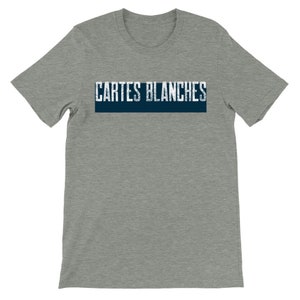 May include: Gray heather short sleeve t-shirt featuring a navy blue horizontal banner with the text 'Cartes Blanches' in a distressed, vintage-style white font. The shirt is a comfortable, casual style, suitable for everyday wear.  The design is simple yet stylish, making it a versatile addition to any wardrobe. The t-shirt is made of a soft, breathable fabric for ultimate comfort.