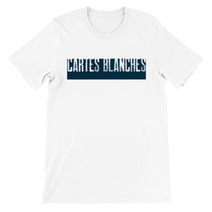 May include: White short sleeve t-shirt featuring a navy blue horizontal banner with the text 'CARTES BLANCHES' in a distressed, vintage-style font. The shirt is a classic crew neck style and appears to be made of a soft, comfortable cotton material.  The overall design is simple and minimalist, ideal for casual wear.