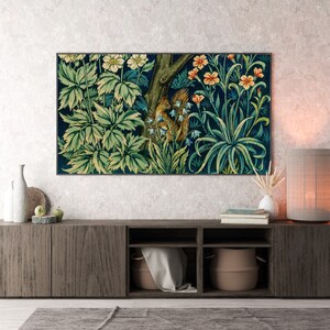 May include: A dark wood media console with three shelves, a tapestry with a floral and animal design hanging above it, and a lamp with a beige shade on the right side.