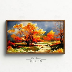 Peut inclure: Une peinture à l'aquarelle d'une scène de forêt avec un chemin qui traverse les arbres. Les arbres sont dans des tons d'orange, de jaune et de rouge, et le ciel est bleu clair avec des nuages. La peinture est encadrée dans un cadre en bois brun.