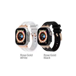Może przedstawiać: Dwa paski do Apple Watch z obudowami w kolorze r&oacute;żowego złota. Jeden pasek jest biały, a drugi czarny.