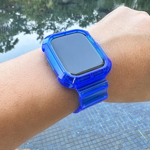 May include: A bright blue protective case for a smartwatch with a clear, transparent band.