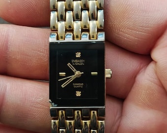 1990s Embassy by Gruen Gold Tone With Black Dial Ladies Diamond Accent Watch