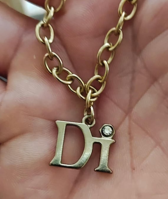 1980’s Diamond International Gold Tone Charm Bracelet