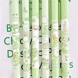 Conjunto de canetas de sapo fofo de 2 peças, conjunto de canetas kawaii, artigos de papelaria fofos, materiais escolares exclusivos