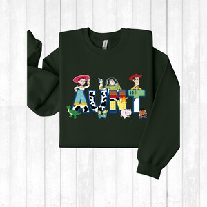 a green shirt with a cartoon character on it