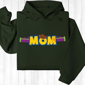 a green hoodie with the word mom printed on it