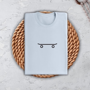 a t - shirt with a face drawn on it
