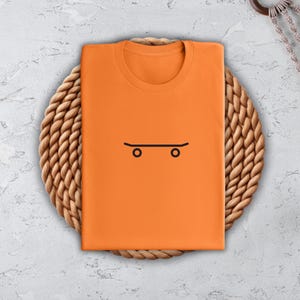 a t - shirt with a skateboard drawn on it
