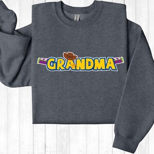 a gray sweatshirt with the word grandma printed on it