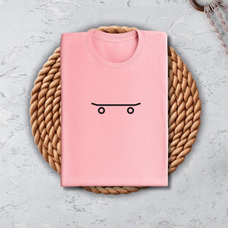 a pink shirt with a face drawn on it