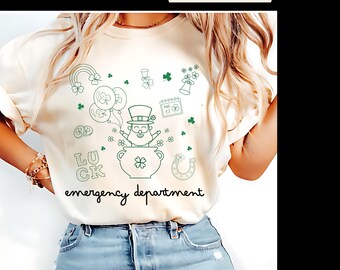 May include: A white t-shirt with a green outline of a leprechaun holding a pot of gold. The shirt also has green outlines of shamrocks, rainbows, horseshoes, and the words "Luck" and "Emergency Department".