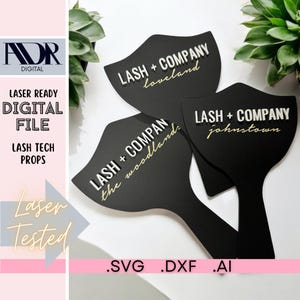 May include: Three black signs with white text that reads "LASH + COMPANY" with the location name below. The locations are "loveland", "the woodlands", and "johnstown".