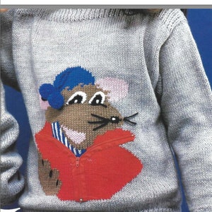 May include: A gray knitted sweater with a colorful mouse applique. The mouse is wearing a blue hat, a red jacket, and a striped shirt.