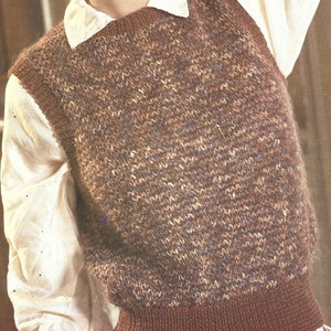 May include: A brown, blue and beige knitted waistcoat with a brown ribbed bottom.