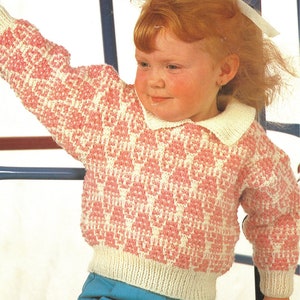 May include: A pink and white checkered sweater with a white collar. The sweater is knitted and has a ribbed hem and cuffs.