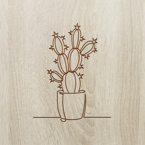 Pu&ograve; includere: Disegno a linea di una pianta di cactus in un vaso su uno sfondo di legno.