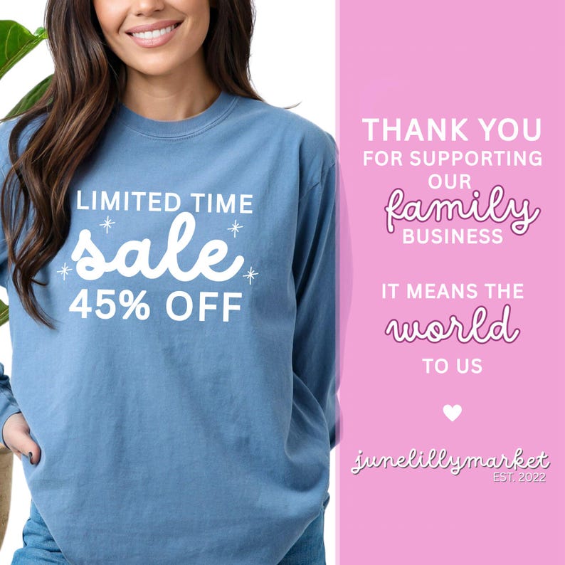 May include: A light blue long-sleeve shirt with the text "LIMITED TIME sale 45% OFF" in white. The shirt also has the text "THANK YOU FOR SUPPORTING OUR family BUSINESS IT MEANS THE world TO US" in white and pink. The brand name "junelillymarket EST. 2022" is also visible.