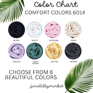 May include: Color chart showcasing eight Comfort Colors 6014 fabric swatches in a variety of colors, including black, white, blossom, ivory, orchid, light green, butter, and pepper. The text "Choose from 8 Beautiful Colors" is also displayed.