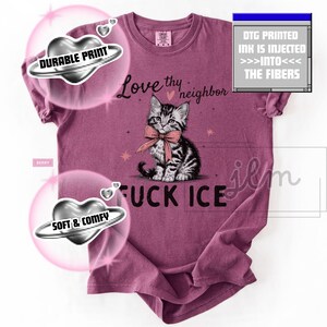 May include: Berry-colored t-shirt featuring a graphic of a kitten wearing a bow tie, with the text "Love thy neighbor" and "FUCK ICE". The shirt has a soft and durable print.