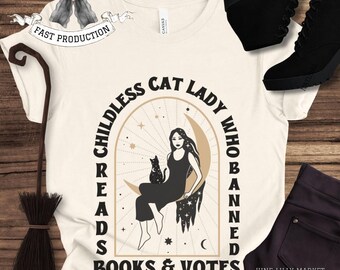 May include: Cream-colored t-shirt with the text "Childless Cat Lady Who Banned Reads Books & Votes." The graphic features a woman and a black cat on a crescent moon. Additional items include black boots, a broom, and dark purple pants.