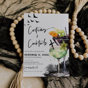 May include: A Halloween party invitation with a black and white bat design and a watercolor illustration of two cocktails. The text reads "Costumes & Cocktails" and "October 31, 20XX".