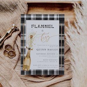 May include: A black and white checked invitation with gold text for a bridal shower. The invitation reads "Flannel & Fizz" and includes the bride-to-be's name, Quinn Bailey, the date and time of the event, and the location. The invitation also includes a graphic of a champagne bottle with a gold cork popping.