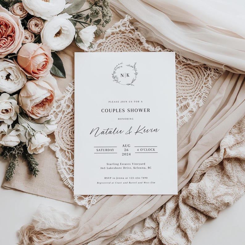 May include: A white wedding shower invitation with a floral wreath and the initials "NK" in the center. The text reads "Please join us for a Couples Shower honoring Natalie & Kevin Saturday, August 26, 4 o'clock 2024 Starling Estates Vineyard 363 Lakeshore Drive, Kelowna, BC RSVP to Jenna at 123-456-7890 Registered at Crate and Barrel and West Elm"