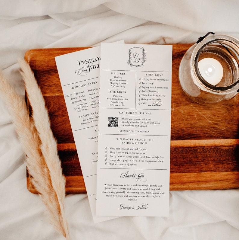 May include: A black and white wedding program with a decorative border. The program includes information about the wedding party, the bride and groom's likes and loves, and a QR code to capture photos. The text includes "Penelope & Julian" and "Thank You".