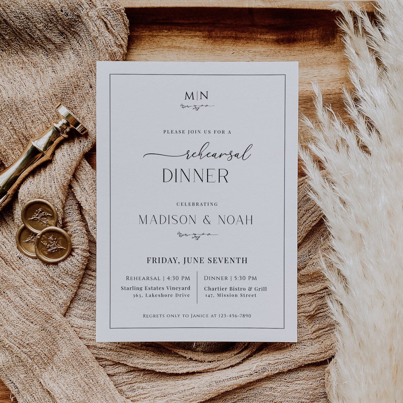 May include: A white card with black text announcing a rehearsal dinner for Madison & Noah. The event will take place on Friday, June Seventh. The rehearsal will be held at Starling Estates Vineyard at 4:30 PM and the dinner will be at Chartier Bistro & Grill at 5:30 PM.  The card includes contact information for regrets only.