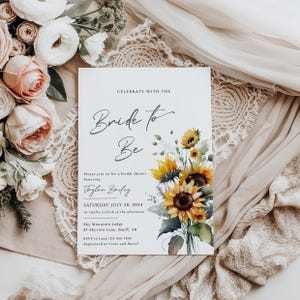 May include: A bridal shower invitation with the text "Bride to Be" in elegant script. The invitation features a watercolor illustration of sunflowers and greenery. The date is Saturday, July 20, 2024.