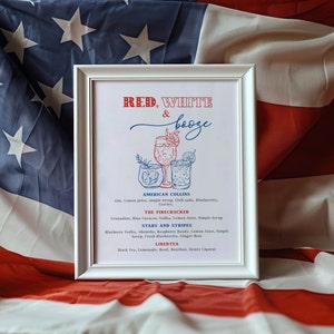 May include: A white framed print with a red, white, and blue color scheme. The print features a title "Red, White & Booze" and lists four cocktail recipes: American Collins, The Firecracker, Stars and Stripes, and Libertea.