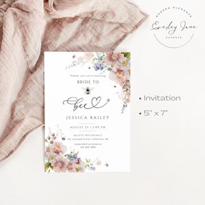 May include: A floral bridal shower invitation with a bee and heart design. The invitation is for Jessica Bailey and is set for August 23rd at 2:00 PM. The invitation is 5 inches by 7 inches.