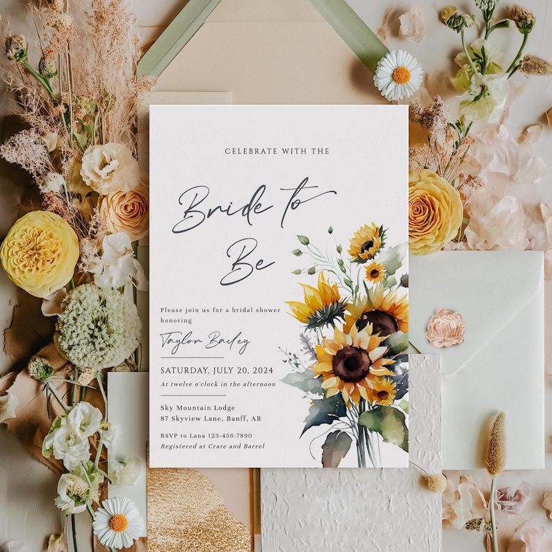 May include: A bridal shower invitation with the text "Bride to Be" in elegant script. The invitation features a watercolor floral arrangement of sunflowers and greenery. The date is Saturday, July 20, 2024, at Sky Mountain Lodge.